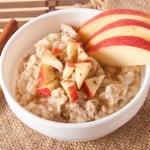 Oatmeal with apples and cinnamon in a white bowl